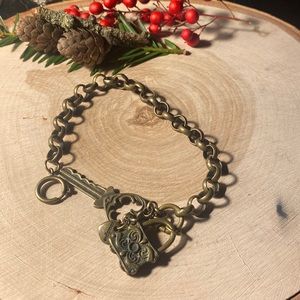 Bracelet with key, lock, heart detail. Bronze.